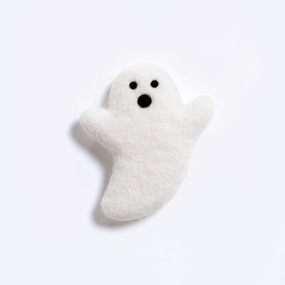 A small white felt ghost toy with black eyes and mouth, photographed on a clean white background.