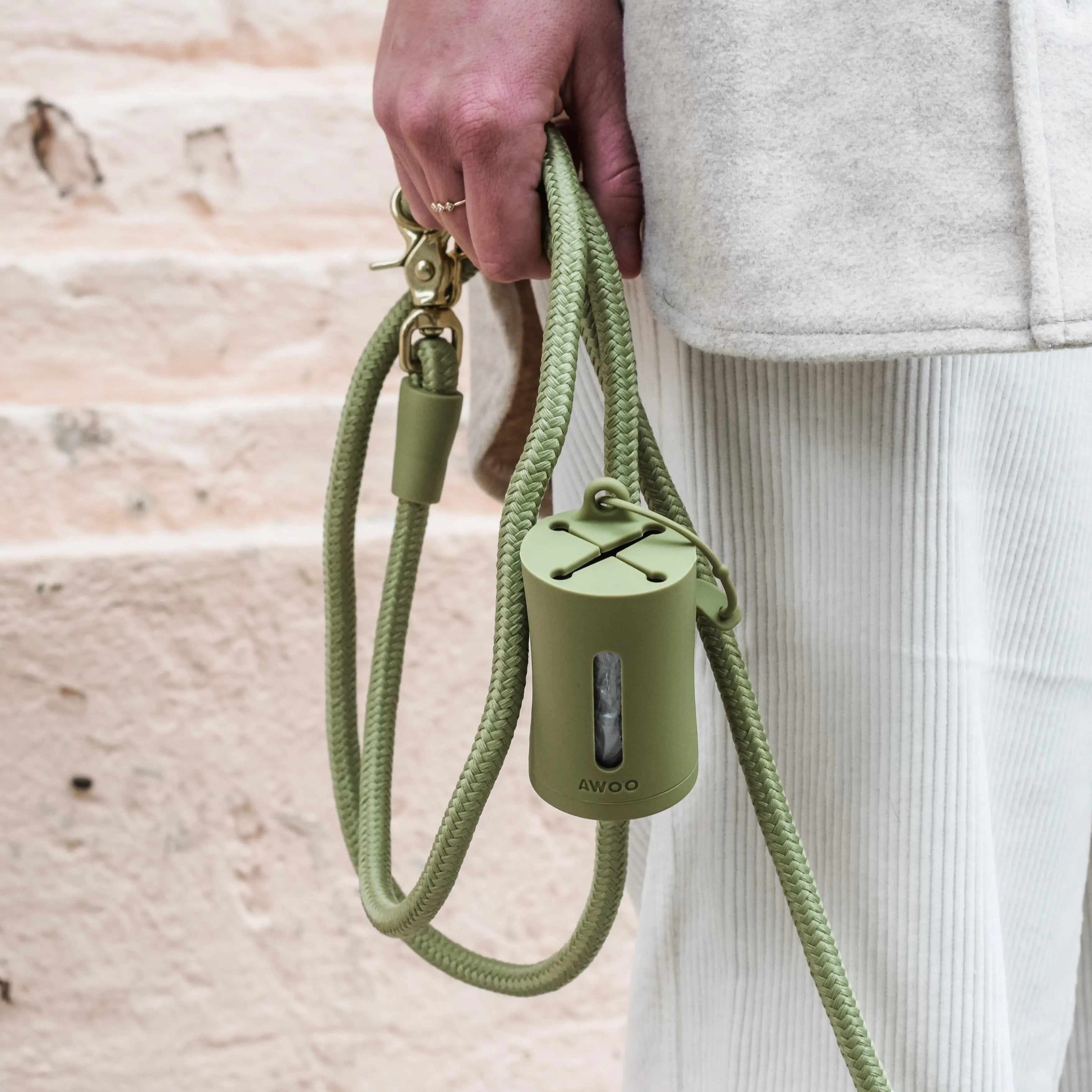 AwPoo Bag Holder: The silicone dangle-free waste bag holder for